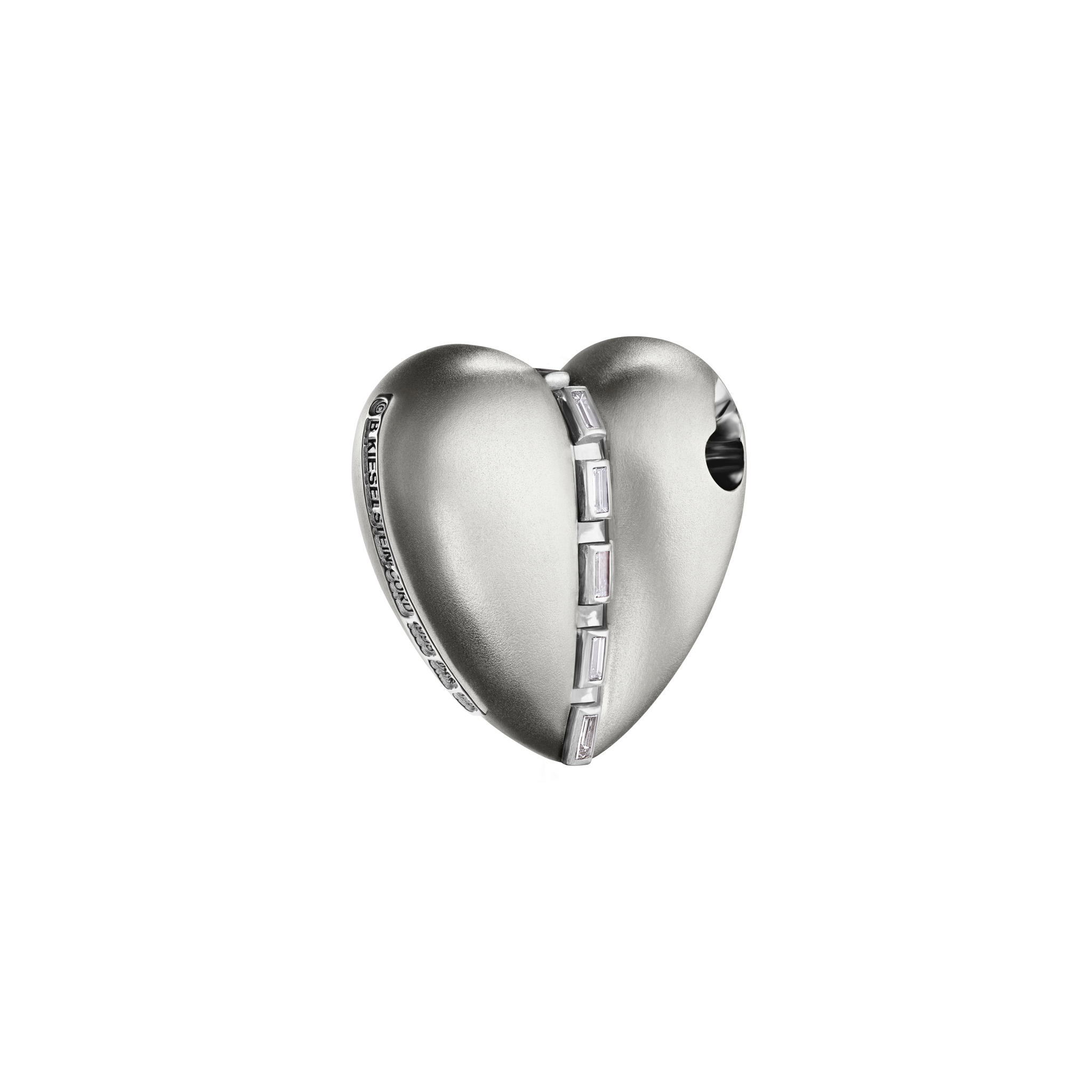 A detail of Bullet Hole Heart Pendant with Baguettes in White Gold